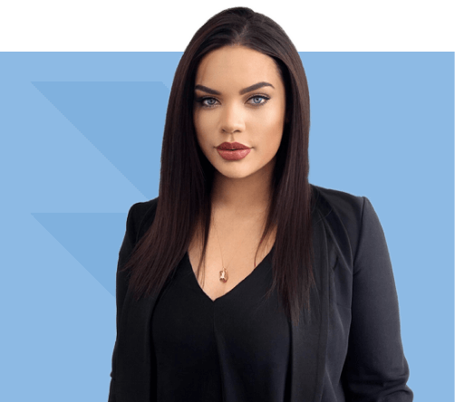 Brooke Wilson with long dark hair wearing a black blazer